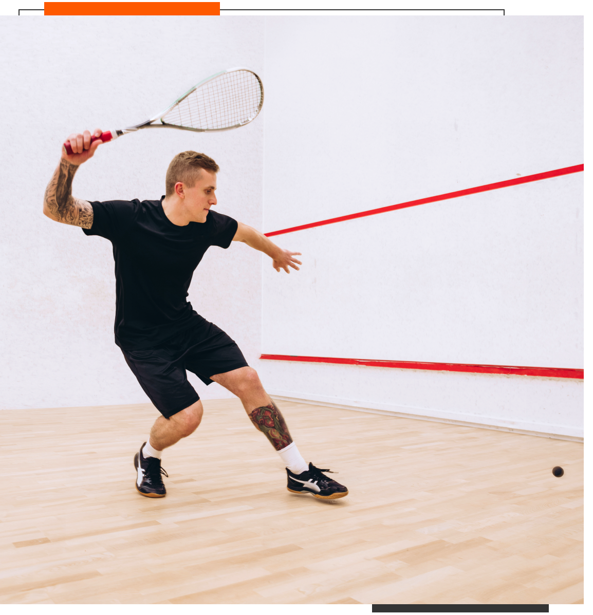 Man playing squash in a court.